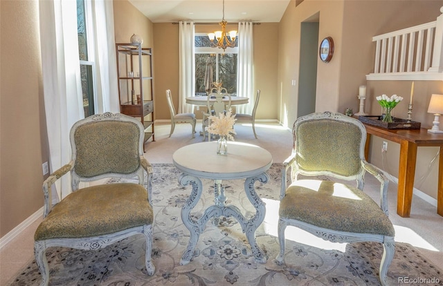 living area with carpet floors and a chandelier