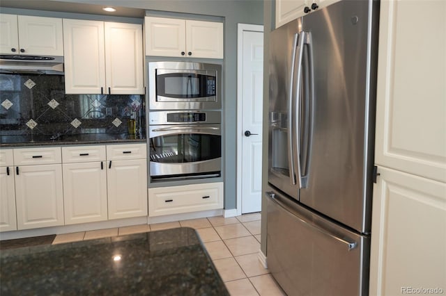 kitchen featuring light tile patterned floors, white cabinets, and appliances with stainless steel finishes