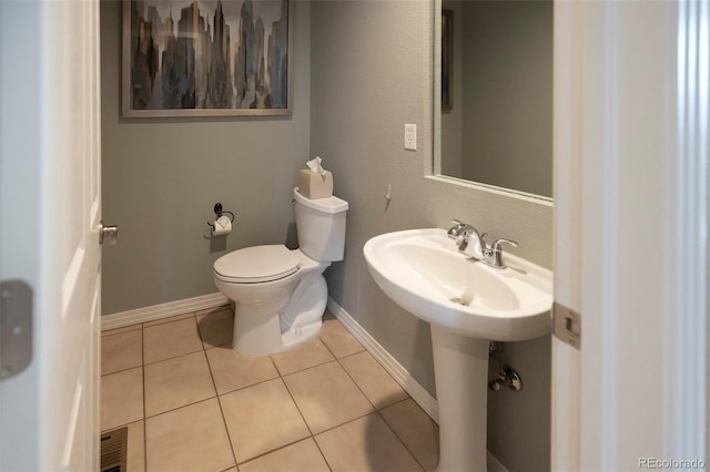 bathroom with tile patterned flooring and toilet