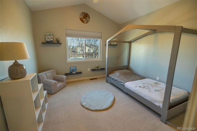 carpeted bedroom with lofted ceiling