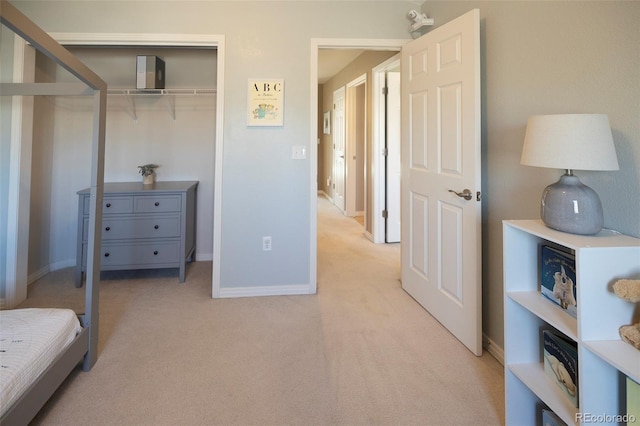 carpeted bedroom with a closet