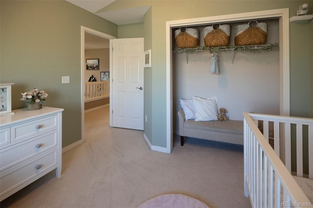 carpeted bedroom with a closet