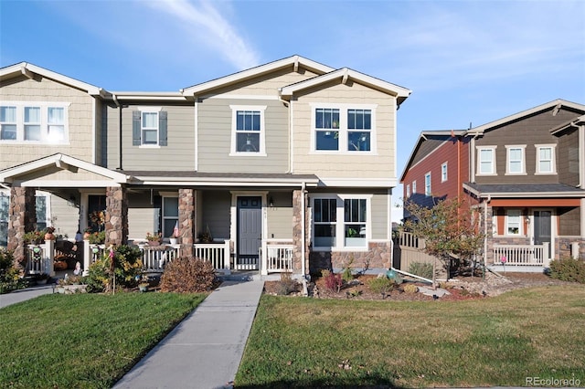 view of front of property with a porch and a front yard