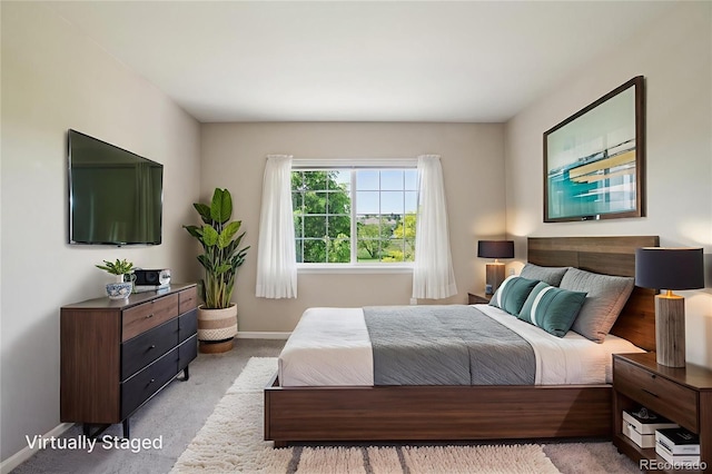 5600 W 3rd St Unit S, Greeley, CO 80634 - bedroom with baseboards and light carpet