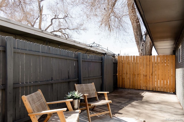 view of patio / terrace featuring fence