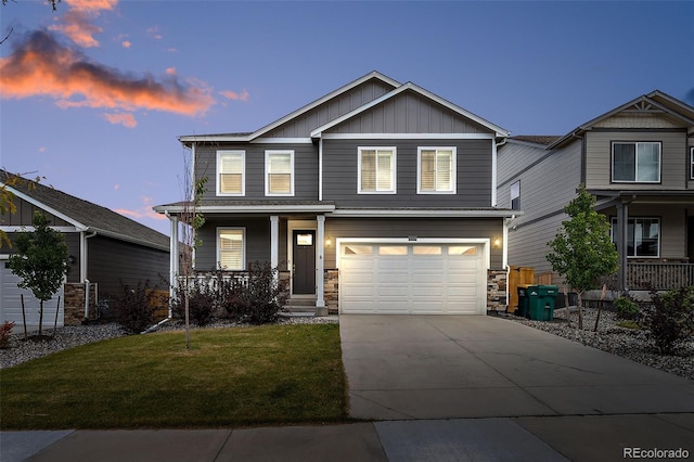 craftsman-style home with a yard and covered porch