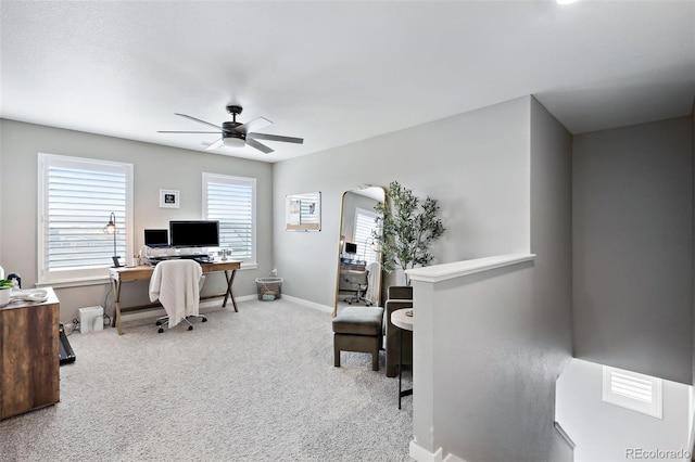 office area with ceiling fan, light colored carpet, and plenty of natural light