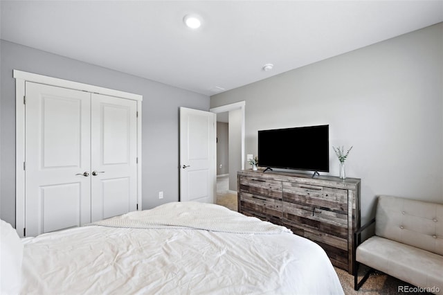 carpeted bedroom with a closet