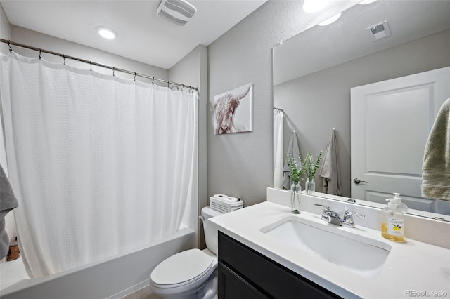 full bathroom featuring shower / bath combo with shower curtain, vanity, and toilet