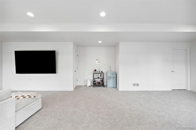 unfurnished living room with light carpet