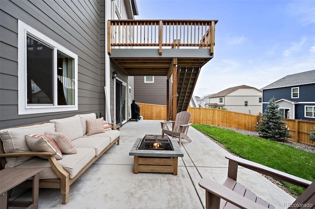 view of patio / terrace featuring an outdoor living space with a fire pit and a wooden deck