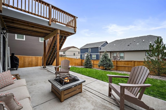 view of patio featuring a fire pit and a deck