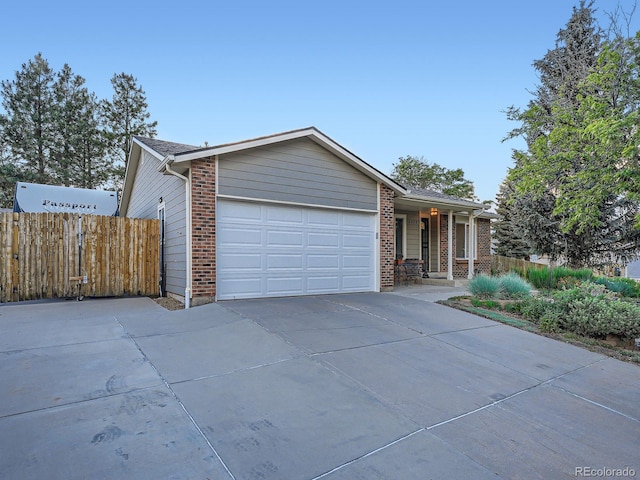 4063 S Cathay Ct, Aurora, CO 80013 - ranch-style house featuring concrete driveway, a garage, and brick siding