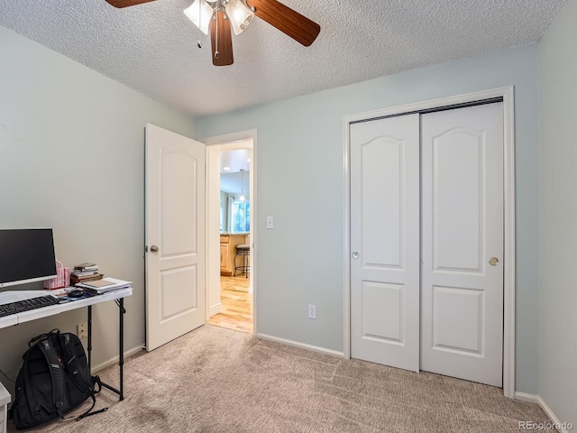 4063 S Cathay Ct, Aurora, CO 80013 - home office featuring ceiling fan, light colored carpet, and a textured ceiling