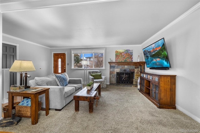 carpeted living area with crown molding, baseboards, and a tile fireplace