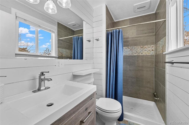 full bath with visible vents, a shower stall, toilet, and vanity