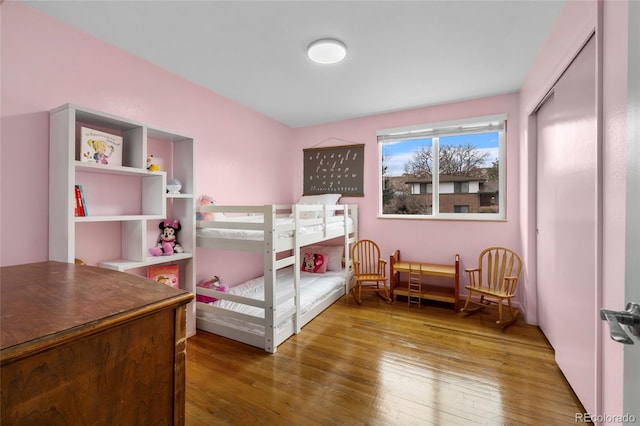 bedroom with hardwood / wood-style floors