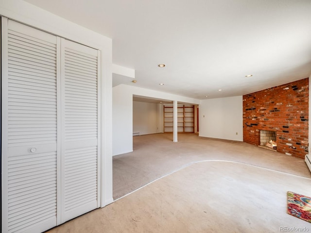 interior space with a baseboard heating unit, recessed lighting, and light colored carpet