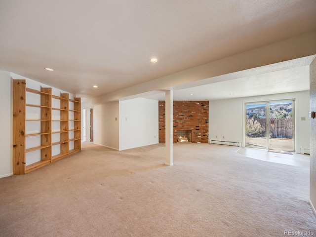 below grade area featuring a baseboard heating unit, a brick fireplace, recessed lighting, and light colored carpet