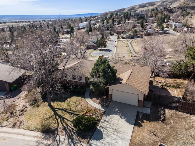 birds eye view of property with a mountain view and a residential view