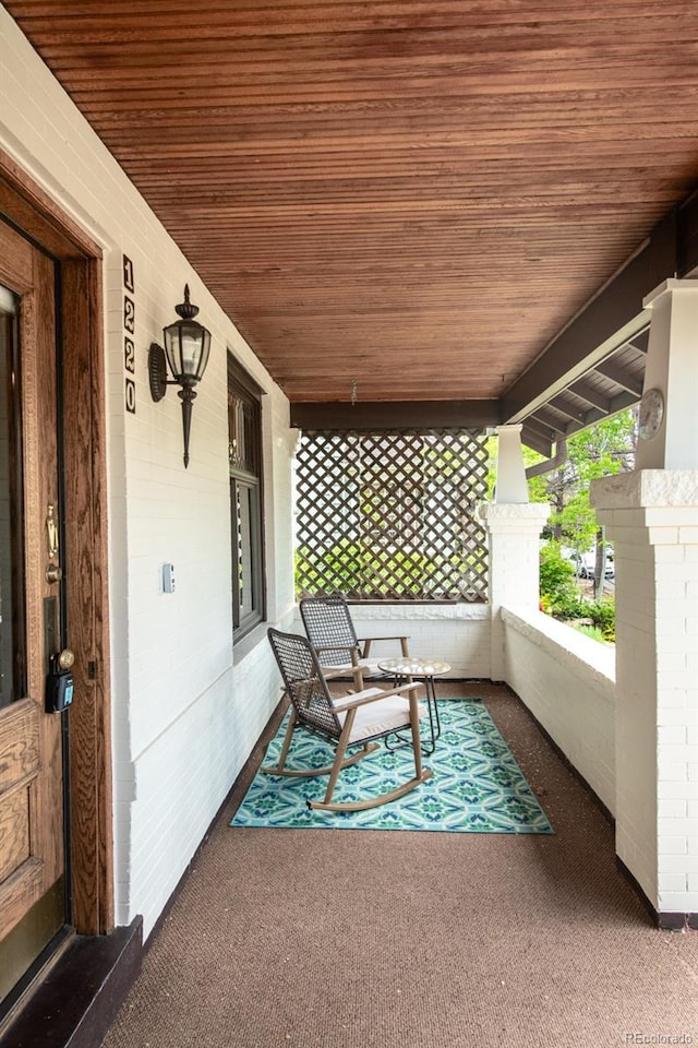 1220 S Vine St, Denver, CO 80210 - view of patio featuring a porch