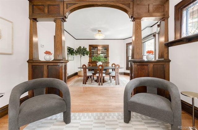 1220 S Vine St, Denver, CO 80210 - living area with plenty of natural light, ornate columns, and light wood-type flooring