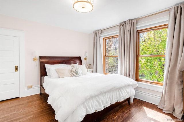1220 S Vine St, Denver, CO 80210 - bedroom with multiple windows and wood finished floors
