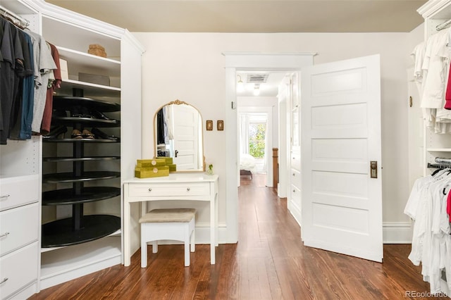 1220 S Vine St, Denver, CO 80210 - walk in closet with dark wood-style flooring