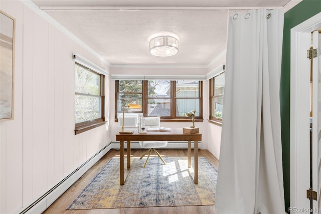 1220 S Vine St, Denver, CO 80210 - office space featuring light wood-type flooring, baseboard heating, crown molding, and a textured ceiling