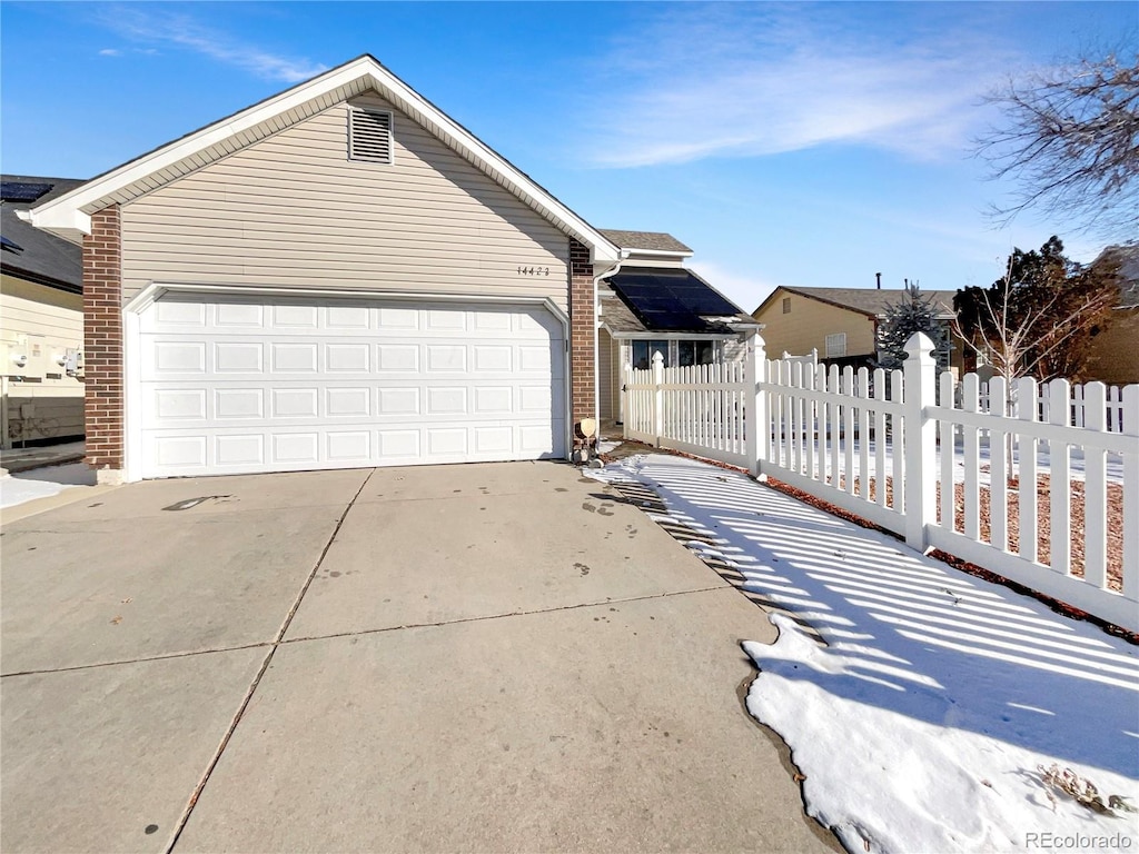 single story home with a garage