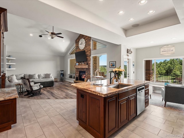 1505 Castlecombe Ln, Monument, CO 80132 - kitchen featuring a sink, recessed lighting, dishwasher, a fireplace, and ceiling fan