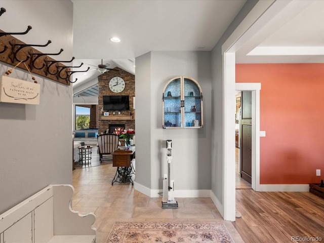 1505 Castlecombe Ln, Monument, CO 80132 - corridor with baseboards, vaulted ceiling, and recessed lighting