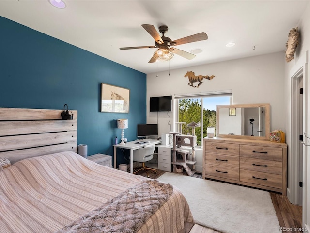 1505 Castlecombe Ln, Monument, CO 80132 - bedroom with wood finished floors, a ceiling fan, and recessed lighting