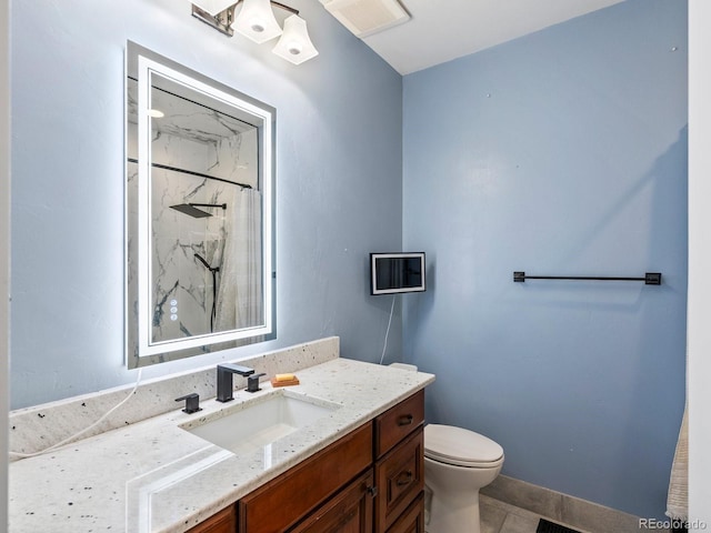 1505 Castlecombe Ln, Monument, CO 80132 - full bath with vanity, toilet, a marble finish shower, tile patterned flooring, and baseboards