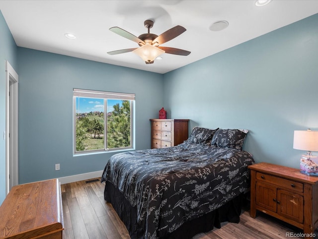 1505 Castlecombe Ln, Monument, CO 80132 - bedroom featuring wood finished floors, baseboards, a ceiling fan, and recessed lighting