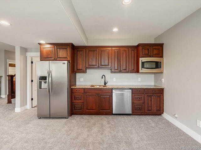 1505 Castlecombe Ln, Monument, CO 80132 - kitchen featuring appliances with stainless steel finishes, a sink, light carpet, baseboards, and recessed lighting
