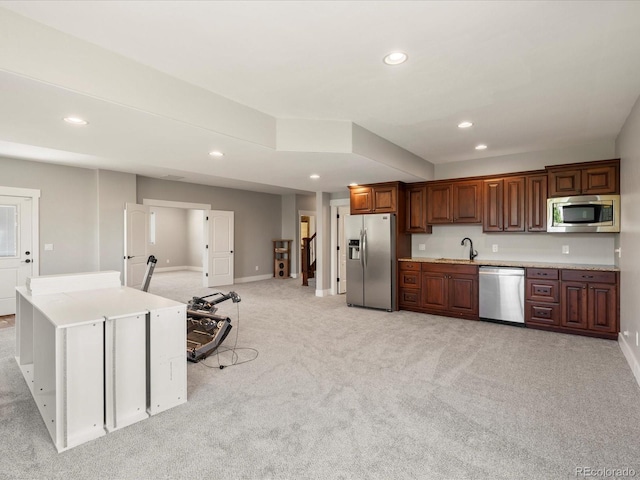 1505 Castlecombe Ln, Monument, CO 80132 - kitchen with appliances with stainless steel finishes, a sink, recessed lighting, light carpet, and light countertops