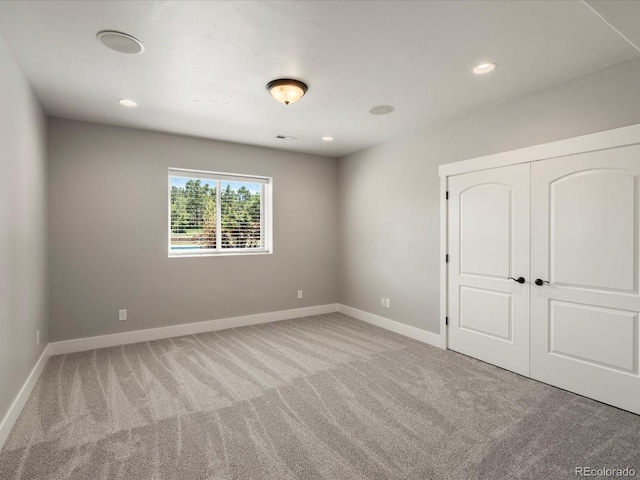 1505 Castlecombe Ln, Monument, CO 80132 - unfurnished bedroom featuring carpet, baseboards, a closet, and recessed lighting