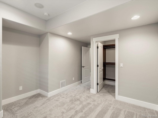 1505 Castlecombe Ln, Monument, CO 80132 - unfurnished bedroom featuring light colored carpet, baseboards, recessed lighting, and a spacious closet