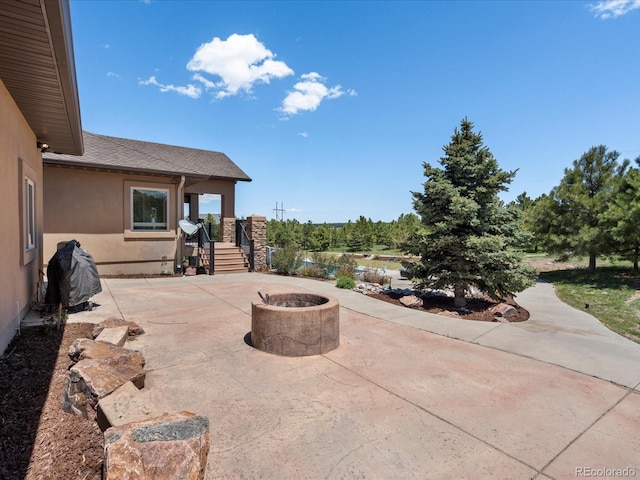 1505 Castlecombe Ln, Monument, CO 80132 - view of patio featuring a fire pit
