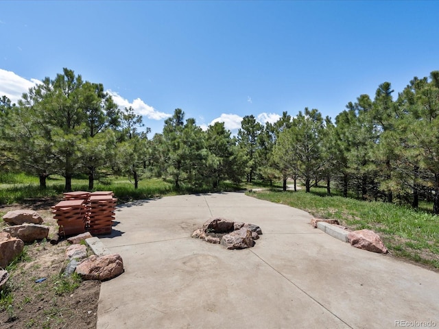 1505 Castlecombe Ln, Monument, CO 80132 - view of patio / terrace featuring an outdoor fire pit