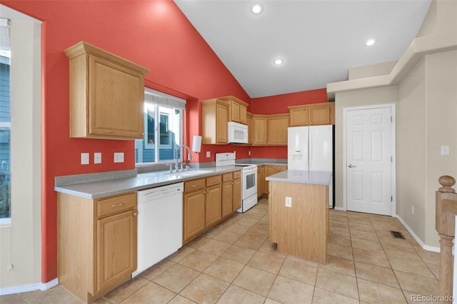 kitchen with vaulted ceiling, a center island, sink, white appliances, and light tile patterned floors