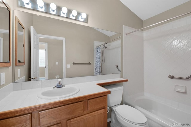 full bathroom with toilet, vanity, vaulted ceiling, and shower / bath combo with shower curtain