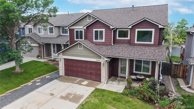 12201 N Holly Way, Brighton, CO 80602 - view of front of property with roof with shingles, concrete driveway, a garage, and a porch