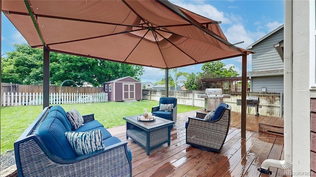 12201 N Holly Way, Brighton, CO 80602 - wooden deck with an outdoor living space and a grill