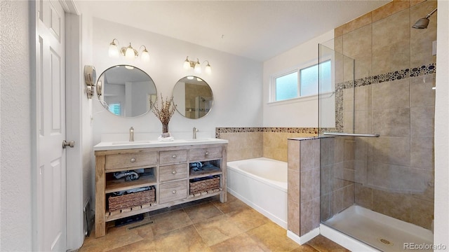 12201 N Holly Way, Brighton, CO 80602 - full bathroom featuring a shower stall, a bath, and double vanity