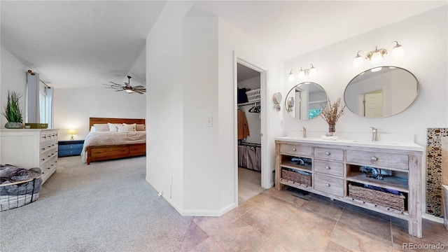 12201 N Holly Way, Brighton, CO 80602 - carpeted bedroom with a spacious closet, a sink, baseboards, and a closet