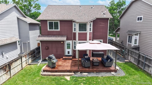 12201 N Holly Way, Brighton, CO 80602 - rear view of house featuring a wooden deck, roof with shingles, a gazebo, a hot tub, and outdoor lounge area