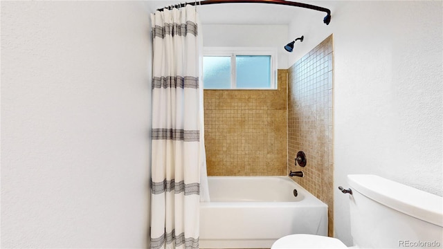 12201 N Holly Way, Brighton, CO 80602 - bathroom with toilet and shower / bath combo with shower curtain