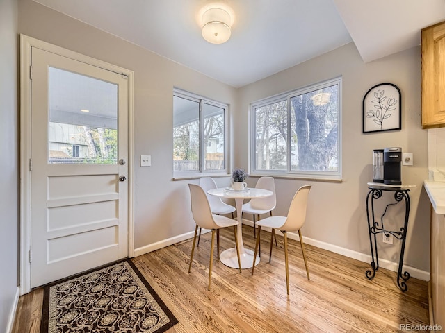 dining area with light hardwood / wood-style flooring